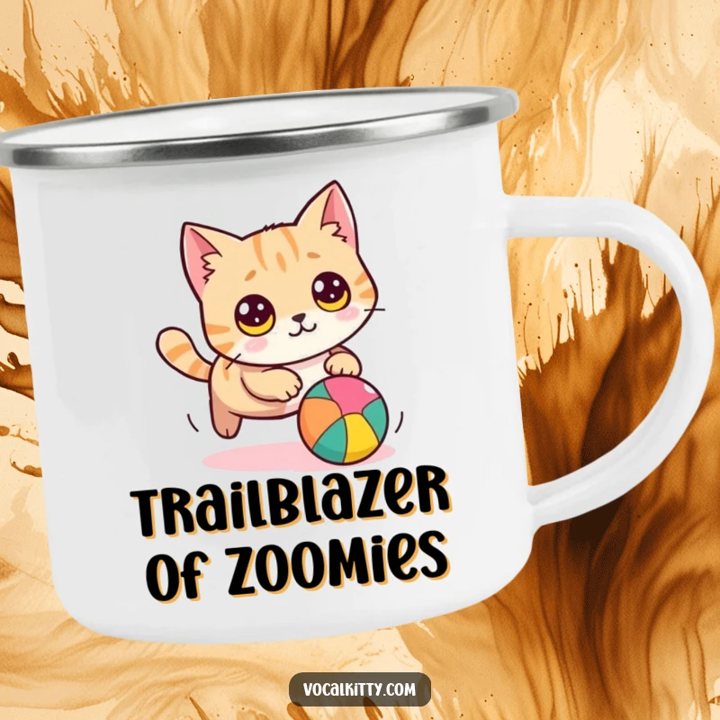 Funny cat camping mug showing a round cat with wide eyes, comically chasing a colorful ball, for durable, humorous outdoor use.