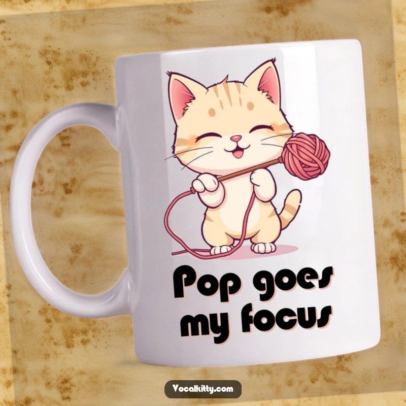 Funny Mug featuring a playful cat batting at a floating soap bubble with its paws, full of joy.